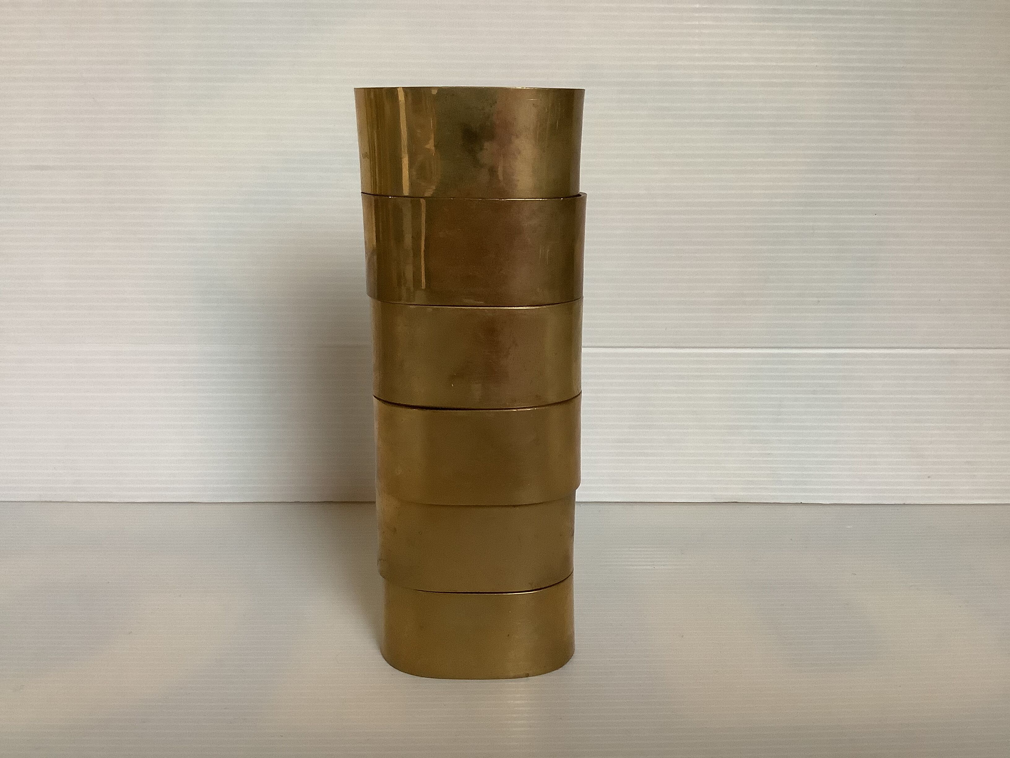 Six old brass napkin rings