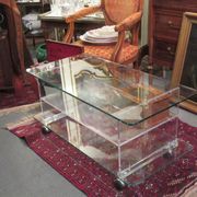 vintage glass coffee table with plexiglass legs