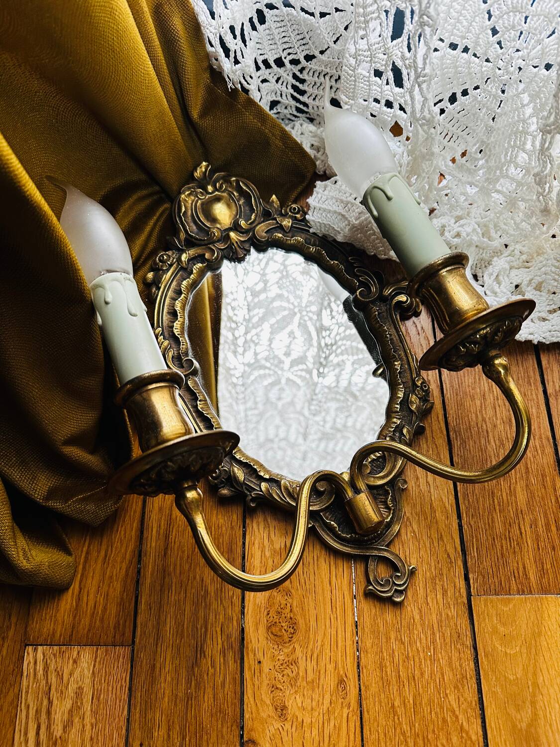 Antique bronze mirror wall sconce