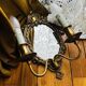 Antique bronze mirror wall sconce