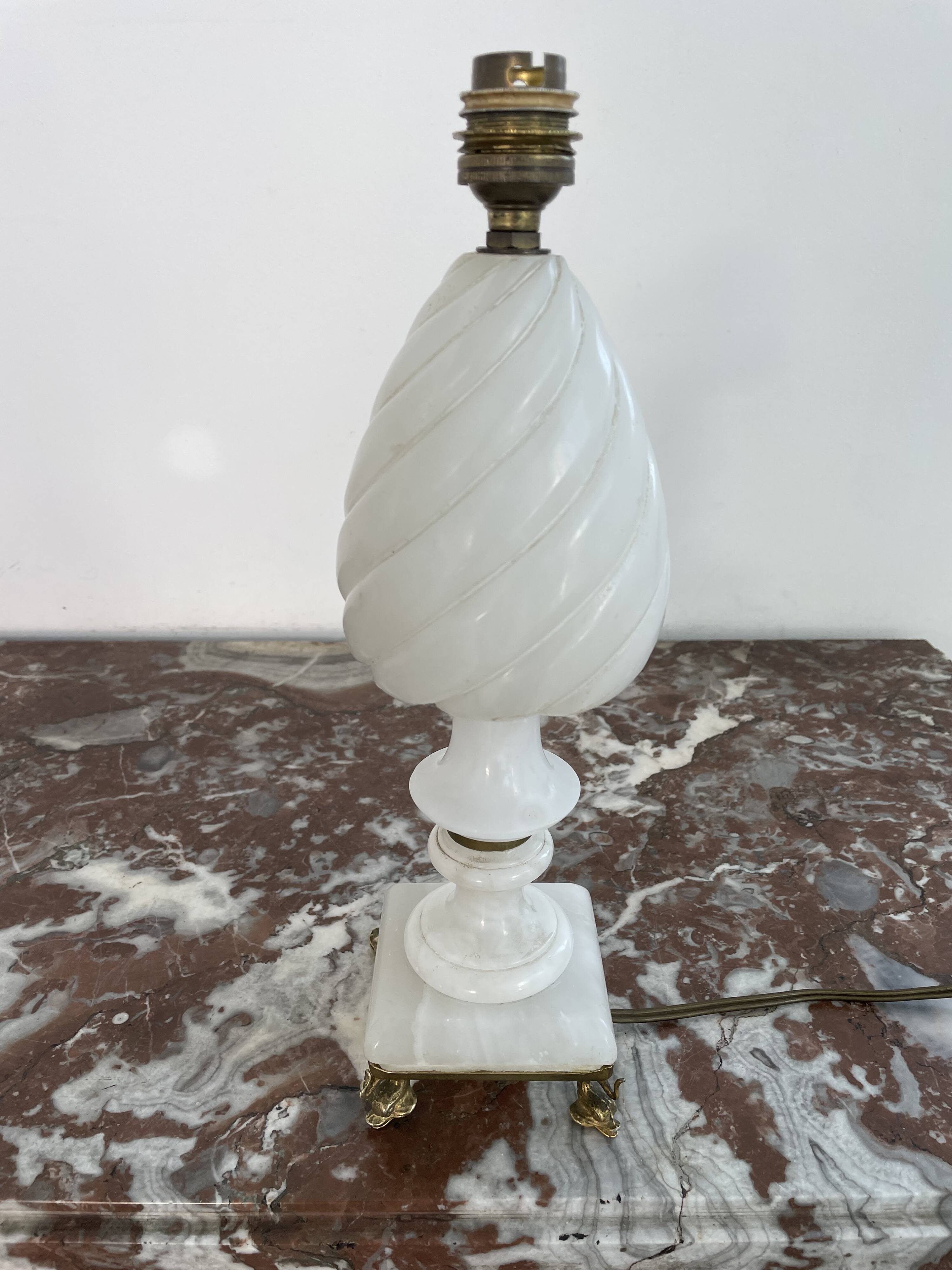 Alabaster lamp, twisted, gadroon decoration, gilded brass base, dolphins