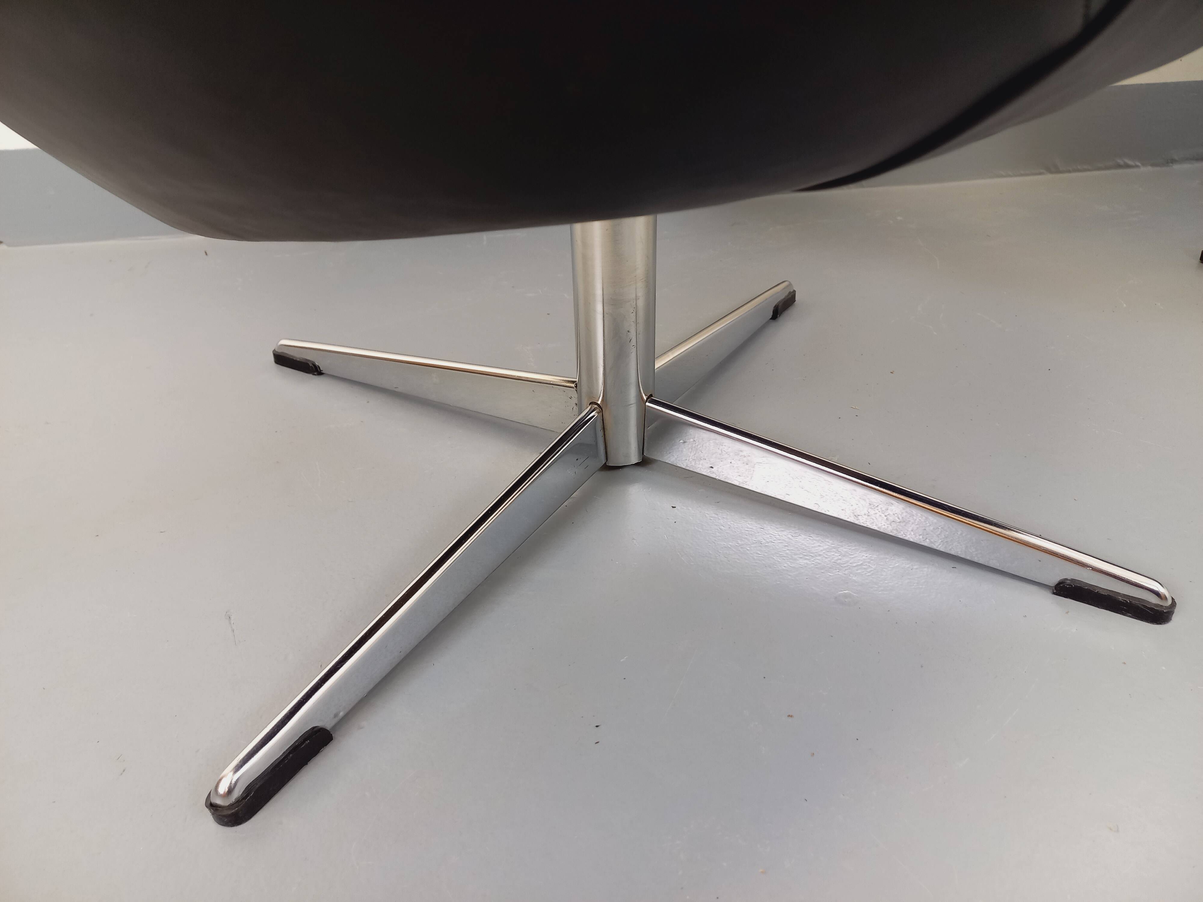 Pair of vintage Scandinavian swivel armchairs in faux leather and chrome.