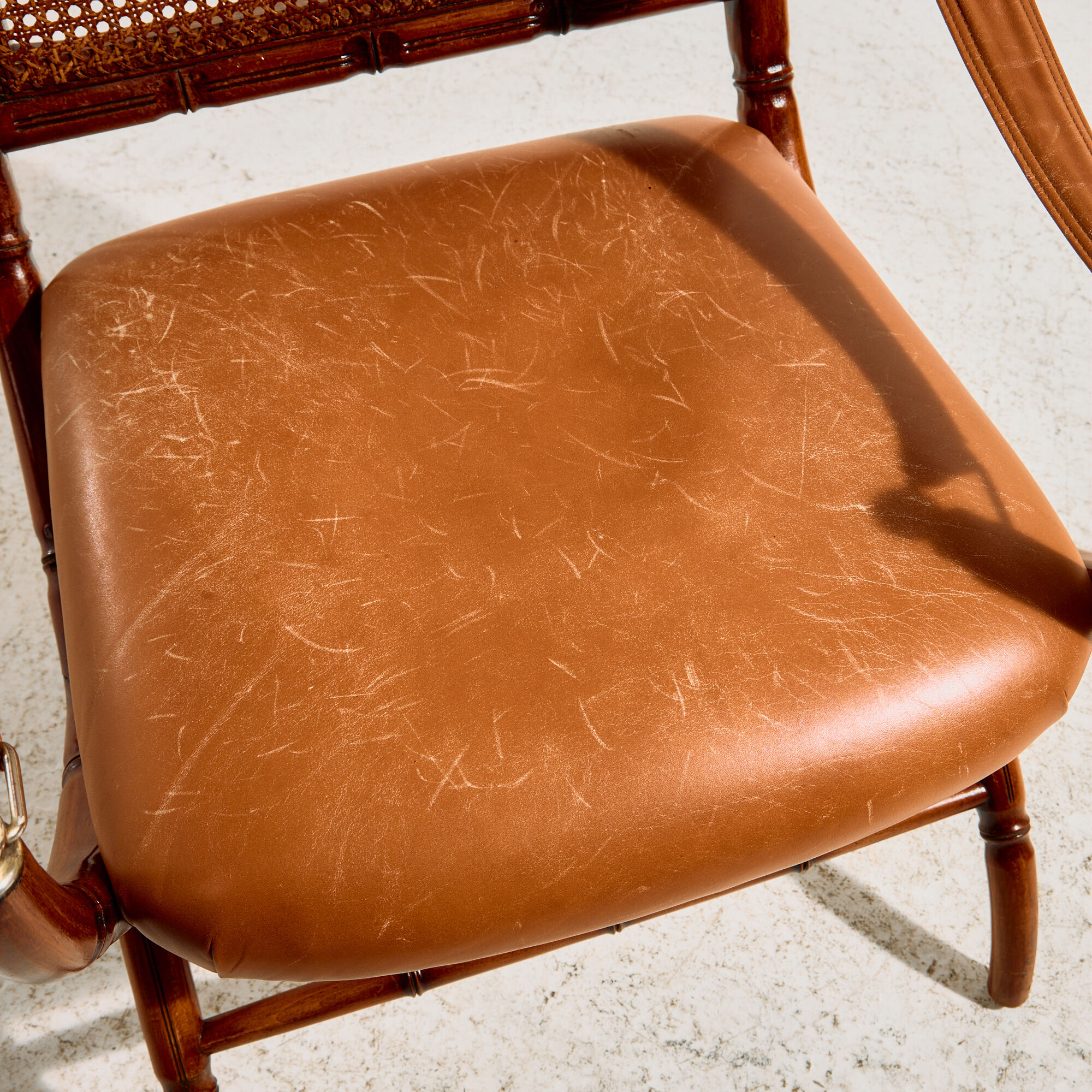 Walnut armchair with bamboo design