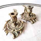 Deux bougeoirs à mains ancien en bronze doré ciselé