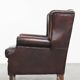 Fauteuil à oreilles de style anglais en cuir de vachette