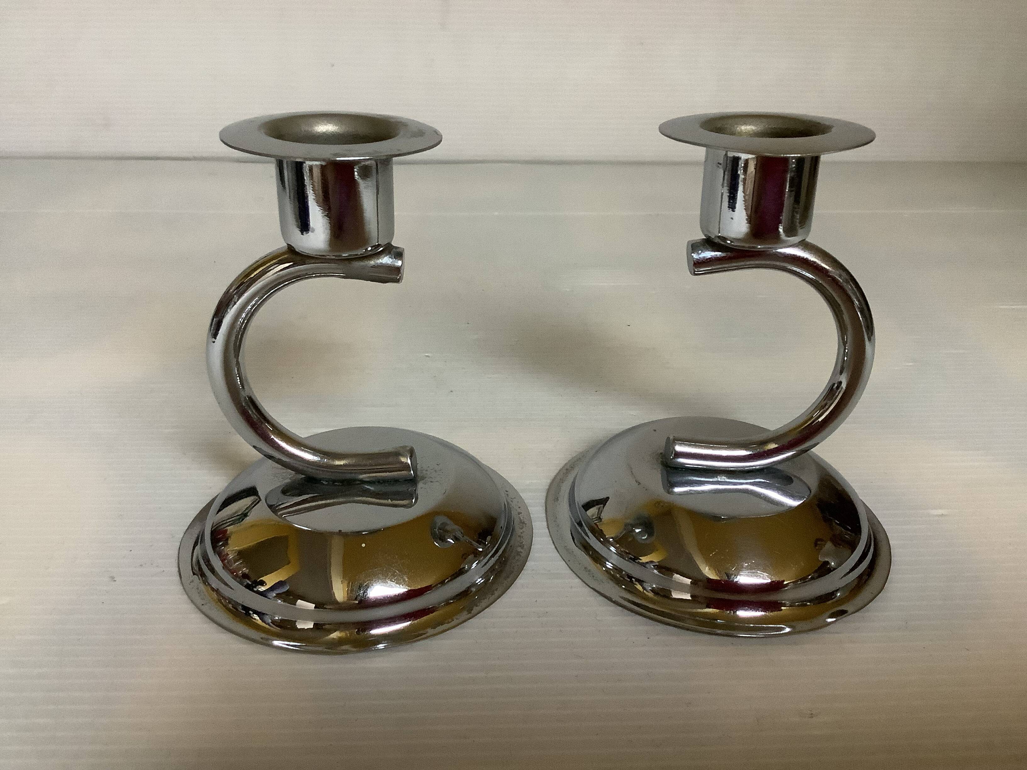 Pair of small silver metal candlesticks