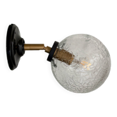 Vintage glass globe wall light with a cracked effect.