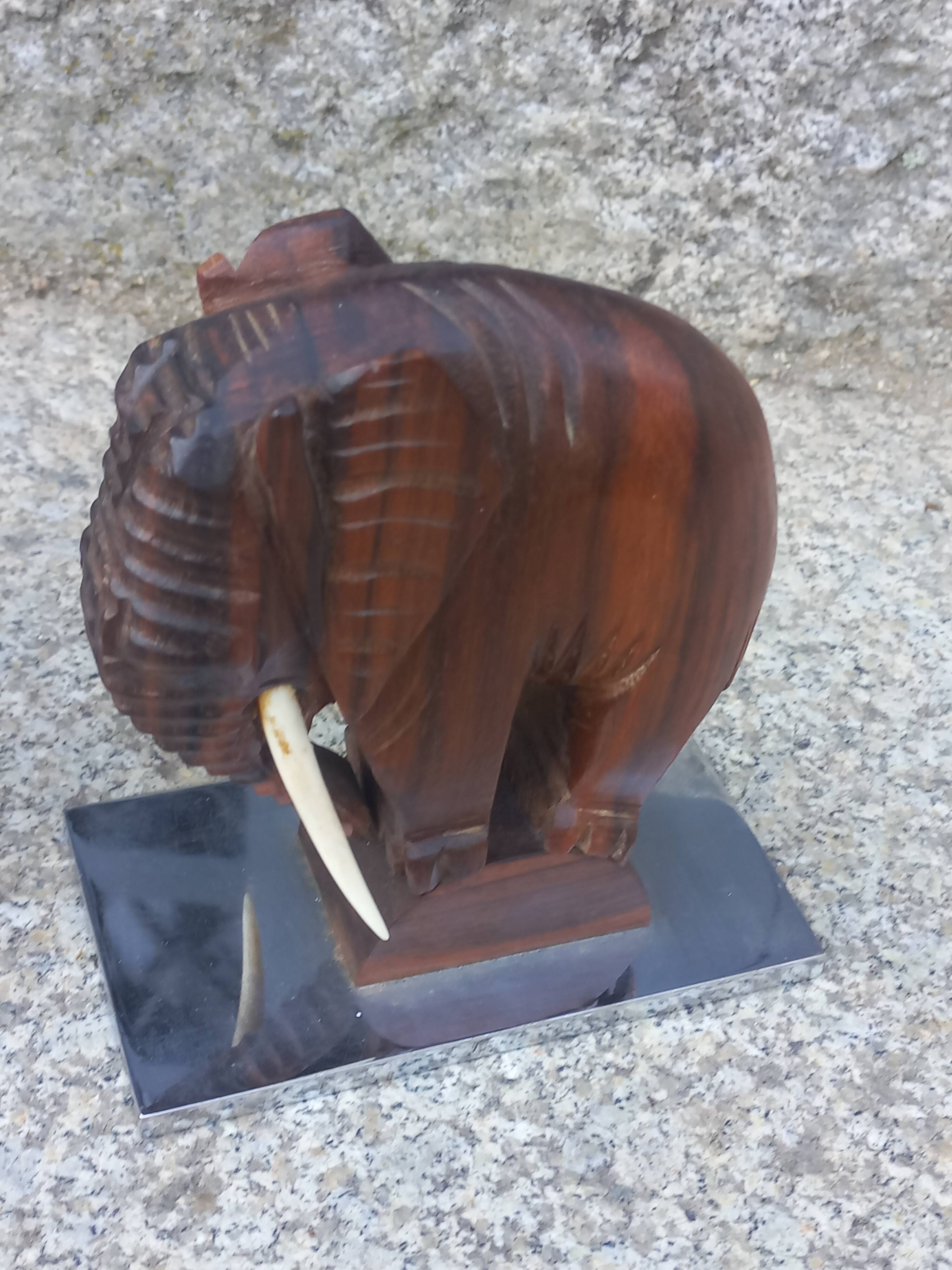 Pair of Art Deco elephant bookends in rosewood with chrome base.