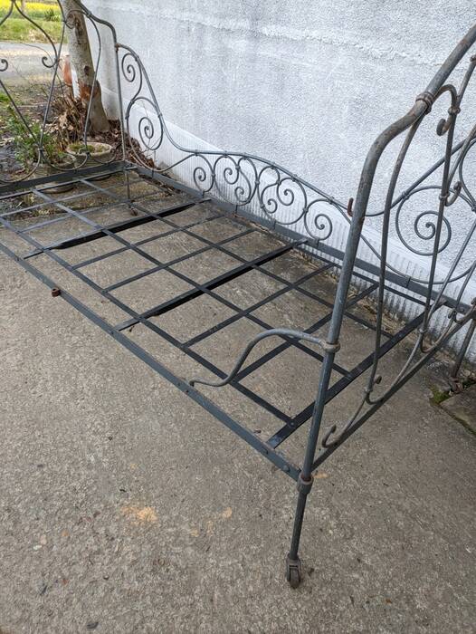 Metal folding bed, wrought iron bench