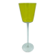 Yellow glass candlestick on a stand