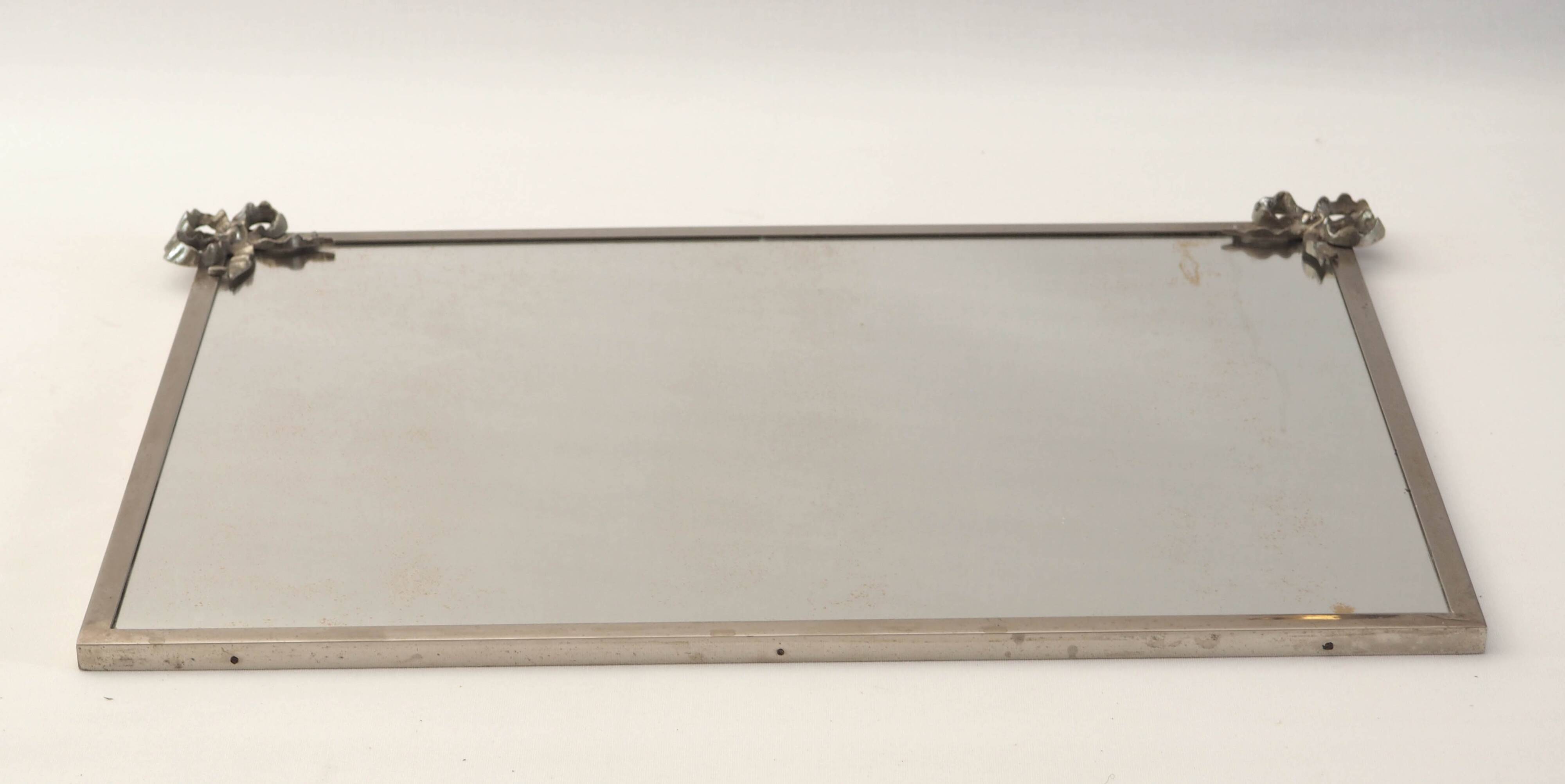 Antique mirror with silver metal rim