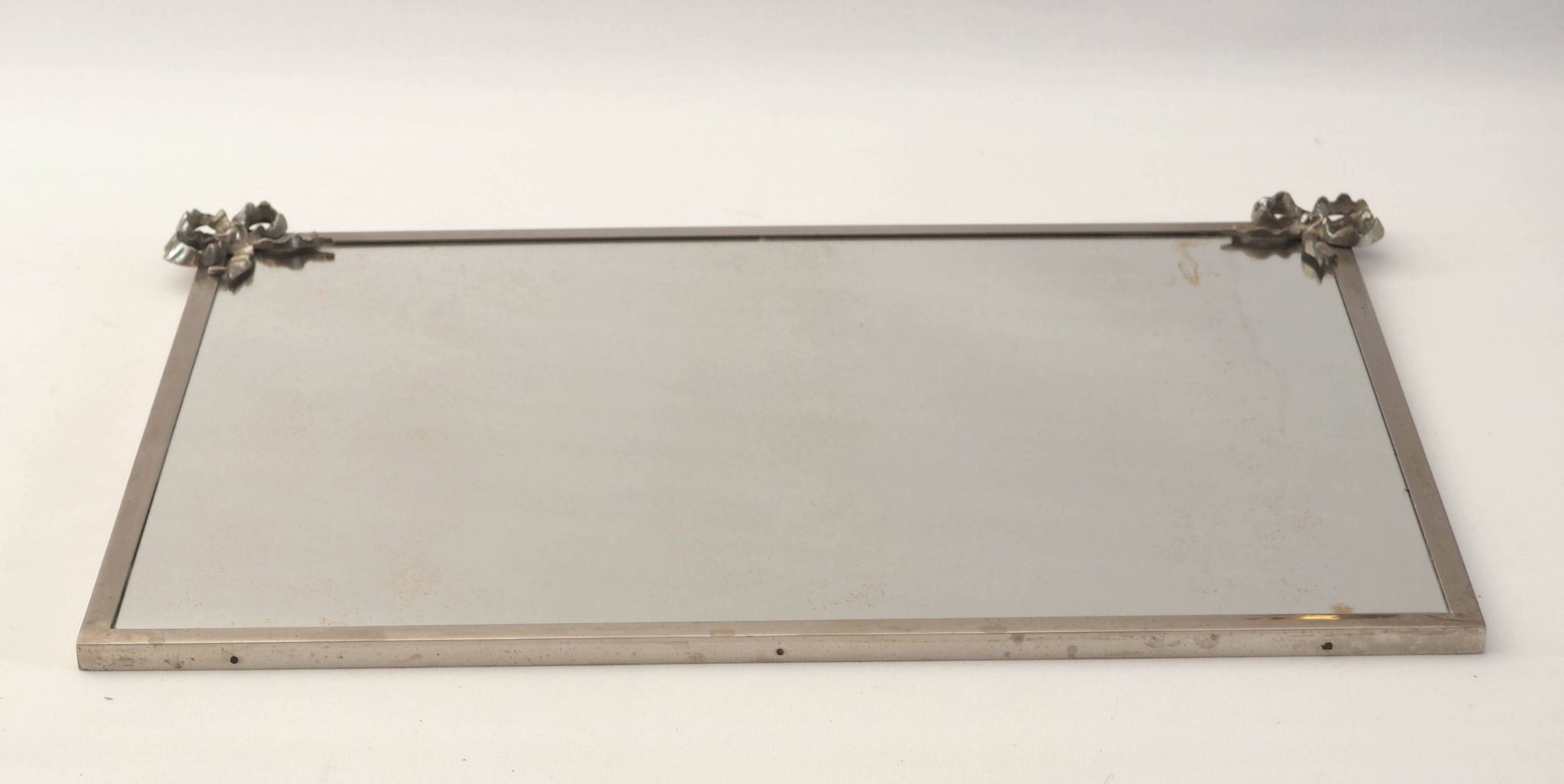 Antique mirror with silver metal rim