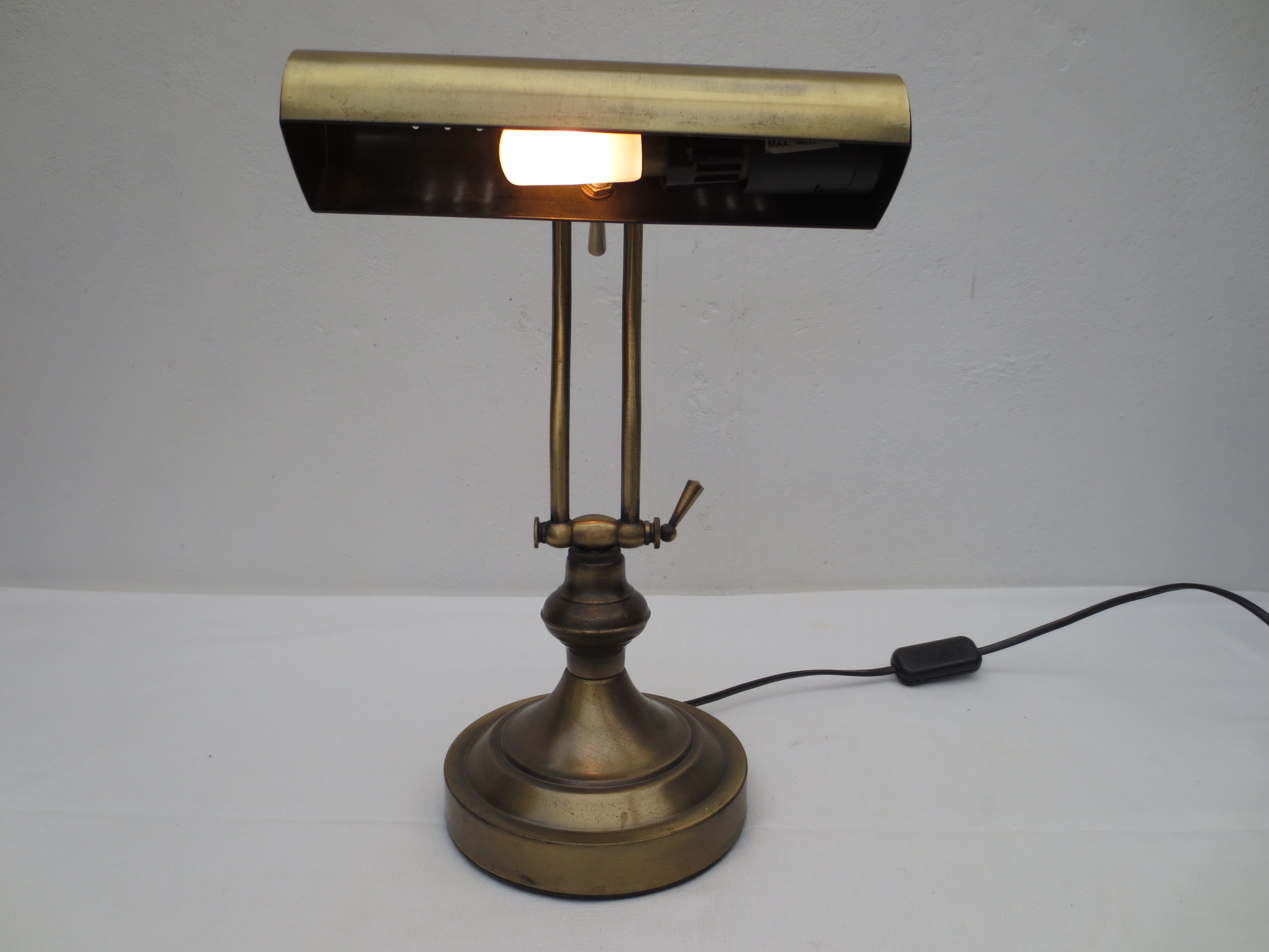 Old aged brass articulated desk lamp