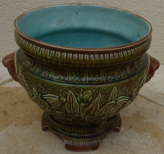 Old earthenware cachepot with woman decoration