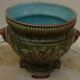 Old earthenware cachepot with woman decoration