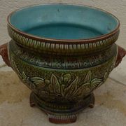 Old earthenware cachepot with woman decoration
