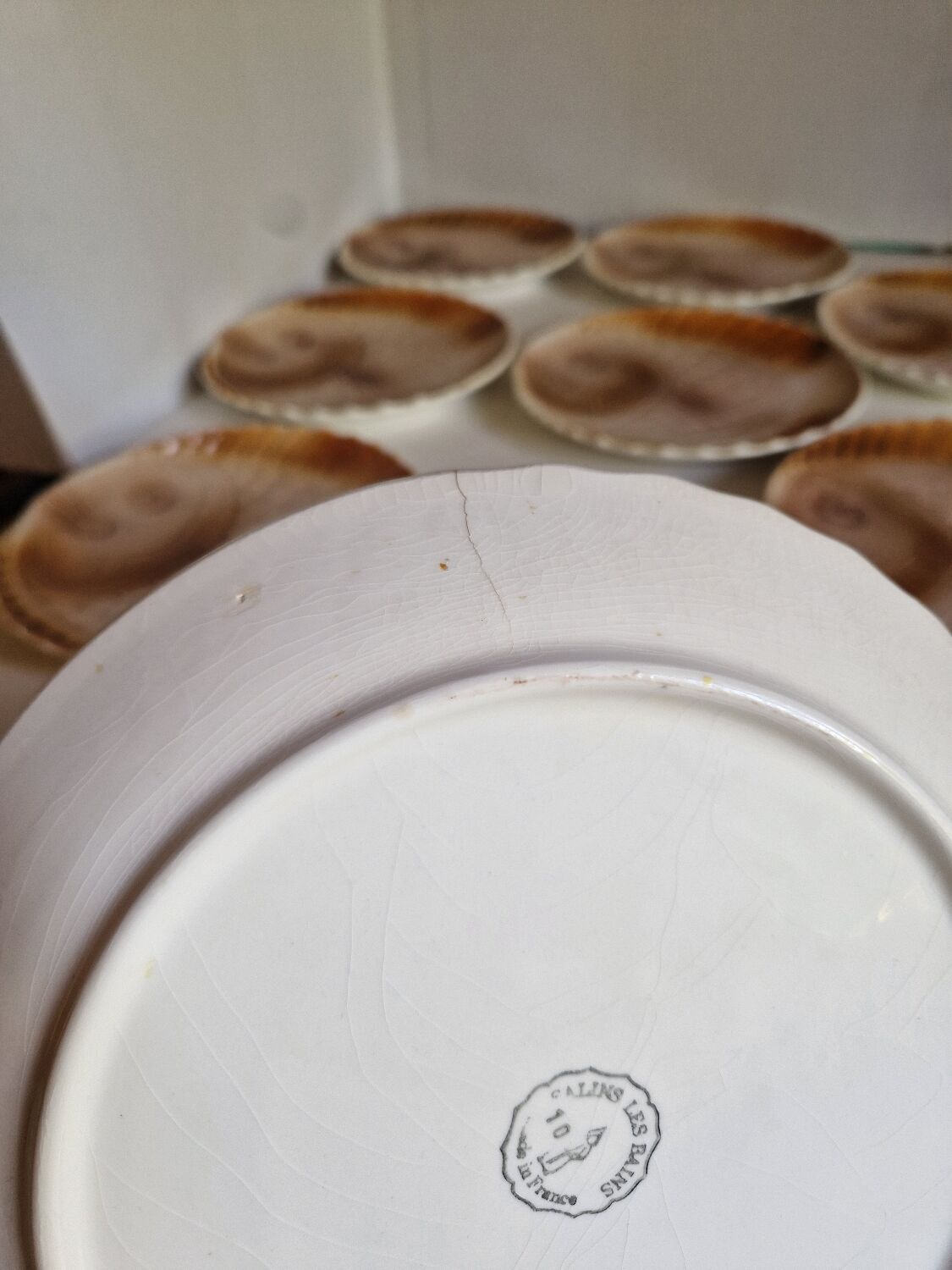 Many flat plates, dish, sauce boat, vegetable dish.