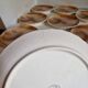Many flat plates, dish, sauce boat, vegetable dish.