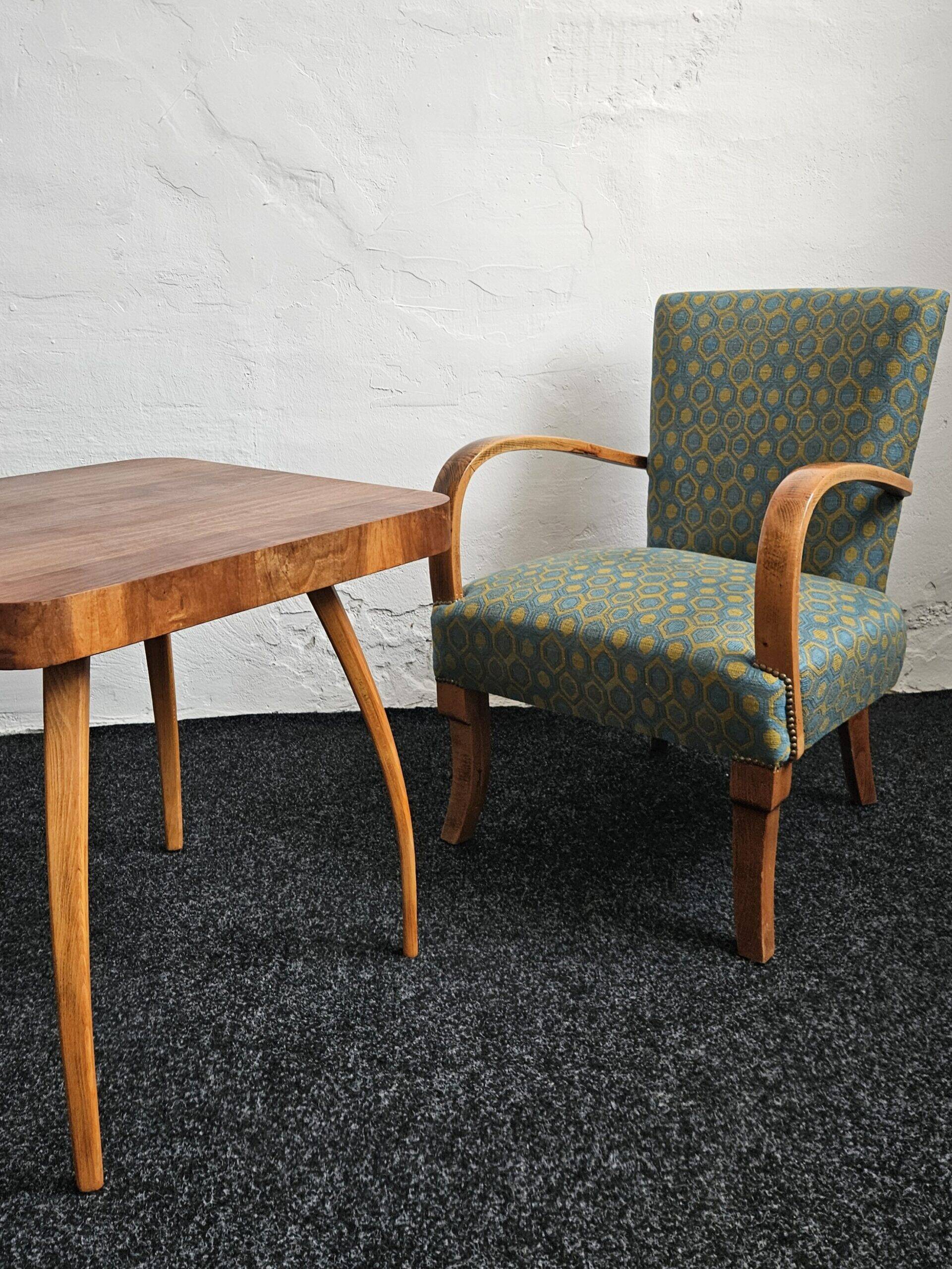 Halabala “Spider” coffee table and Hungarian late Art Deco armchairs, 1950s