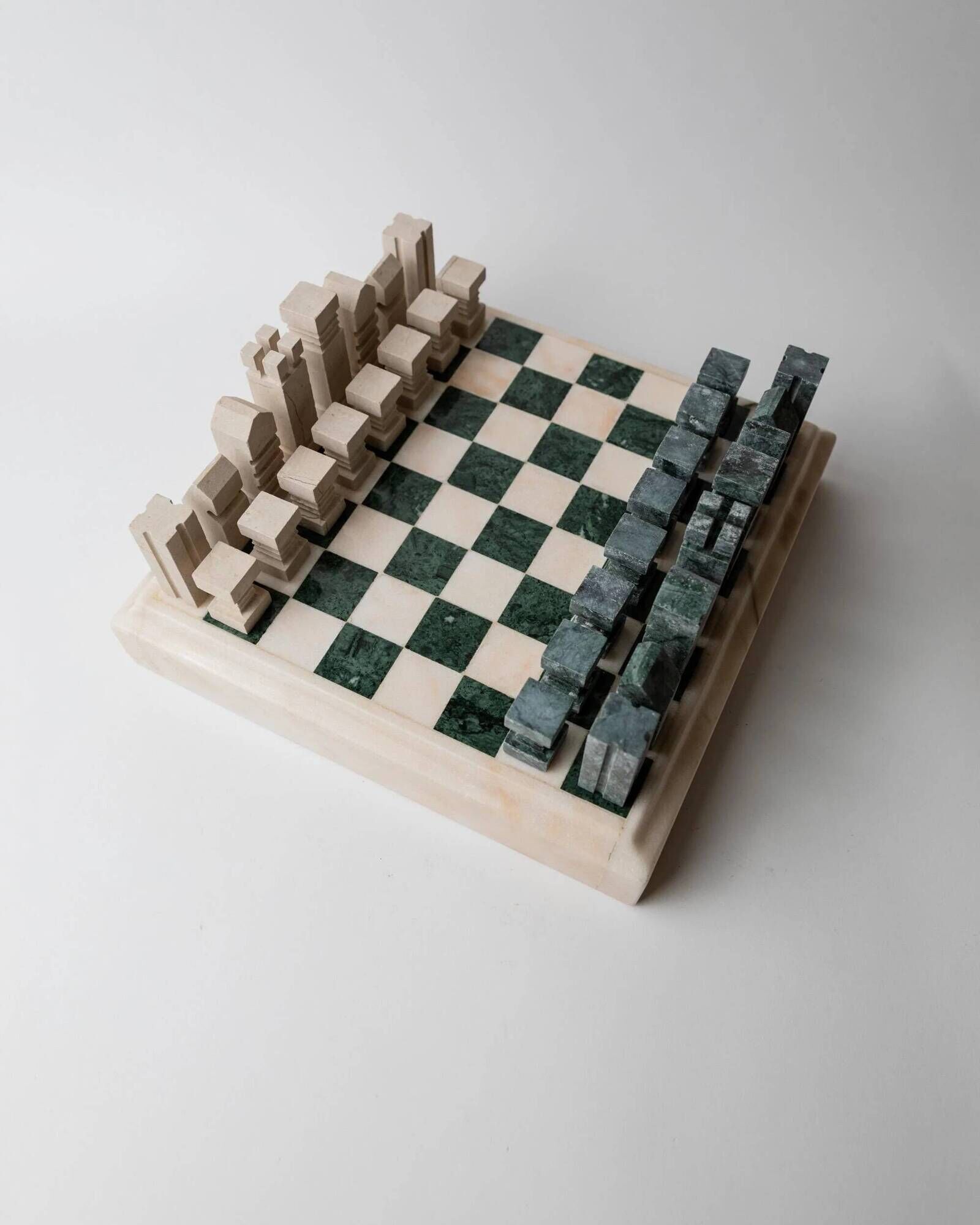 Vintage marble chess set from the 1970s, green and beige stone board, heavy design, geometric pieces, sculptural tabletop game, gift idea.
