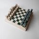 Vintage marble chess set from the 1970s, green and beige stone board, heavy design, geometric pieces, sculptural tabletop game, gift idea.