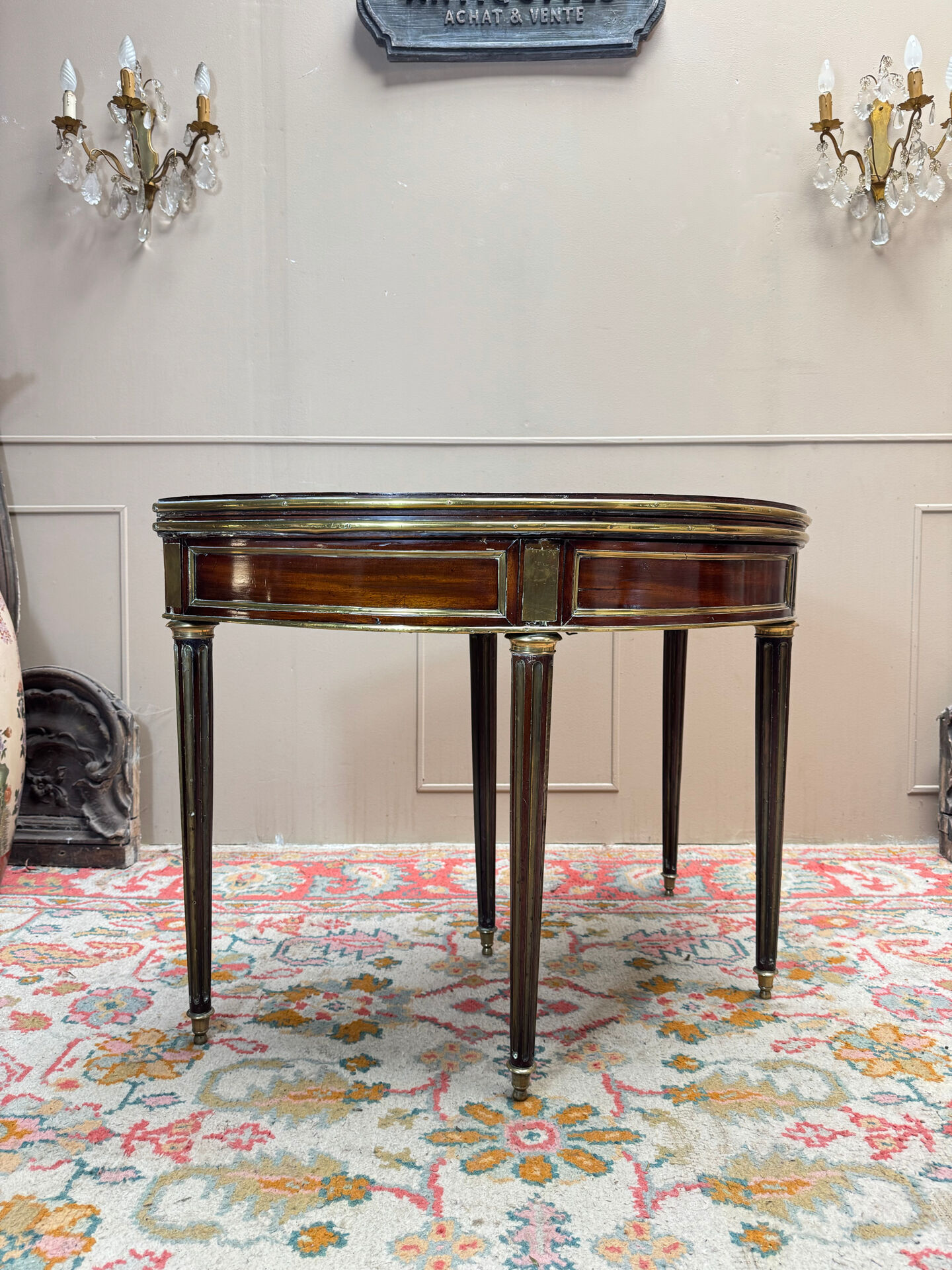 Half-moon table in mahogany from the Louis XVI period, 18th century.
