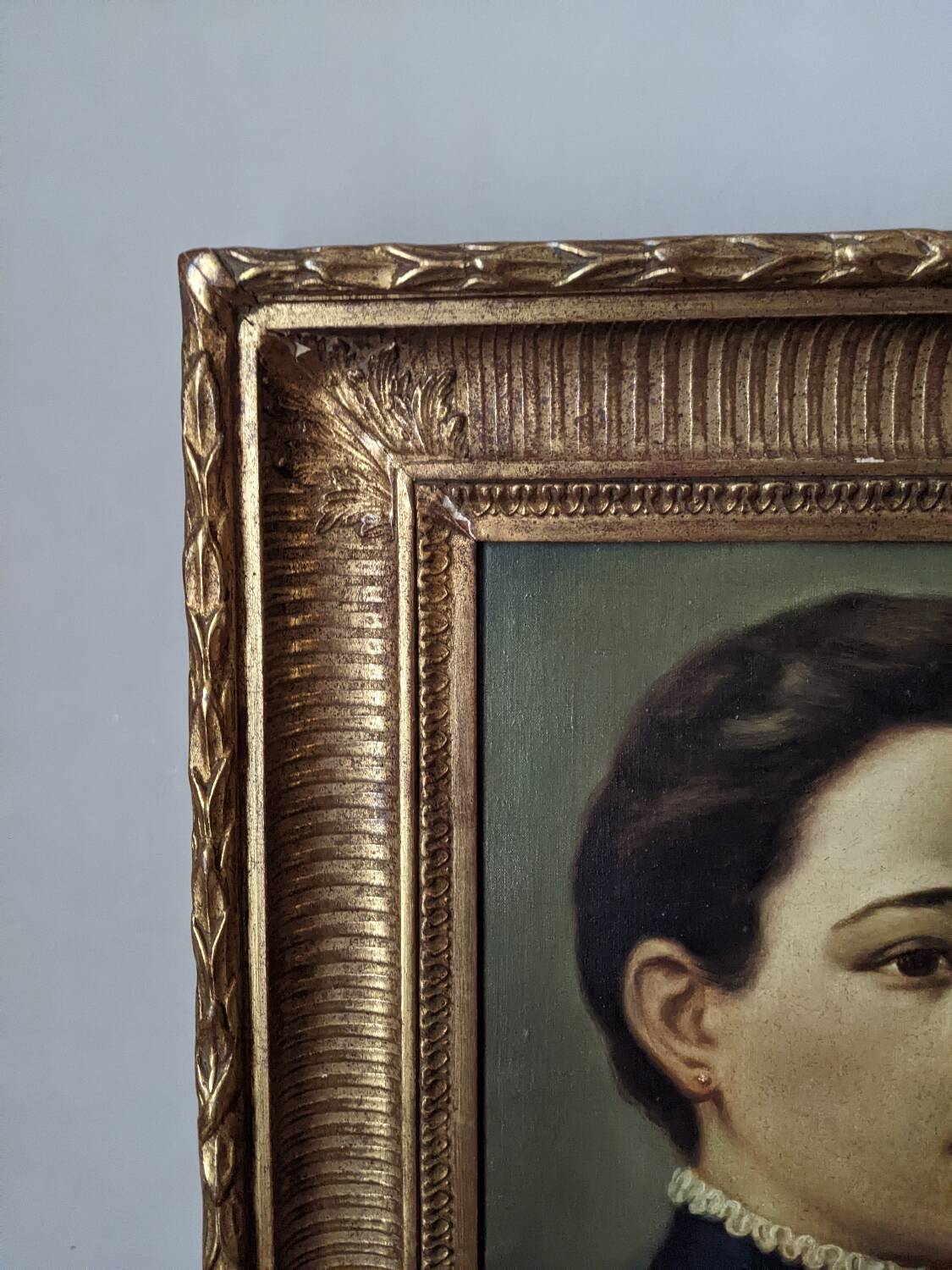 Oil on canvas portrait in an antique gilded wooden frame.