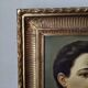 Oil on canvas portrait in an antique gilded wooden frame.