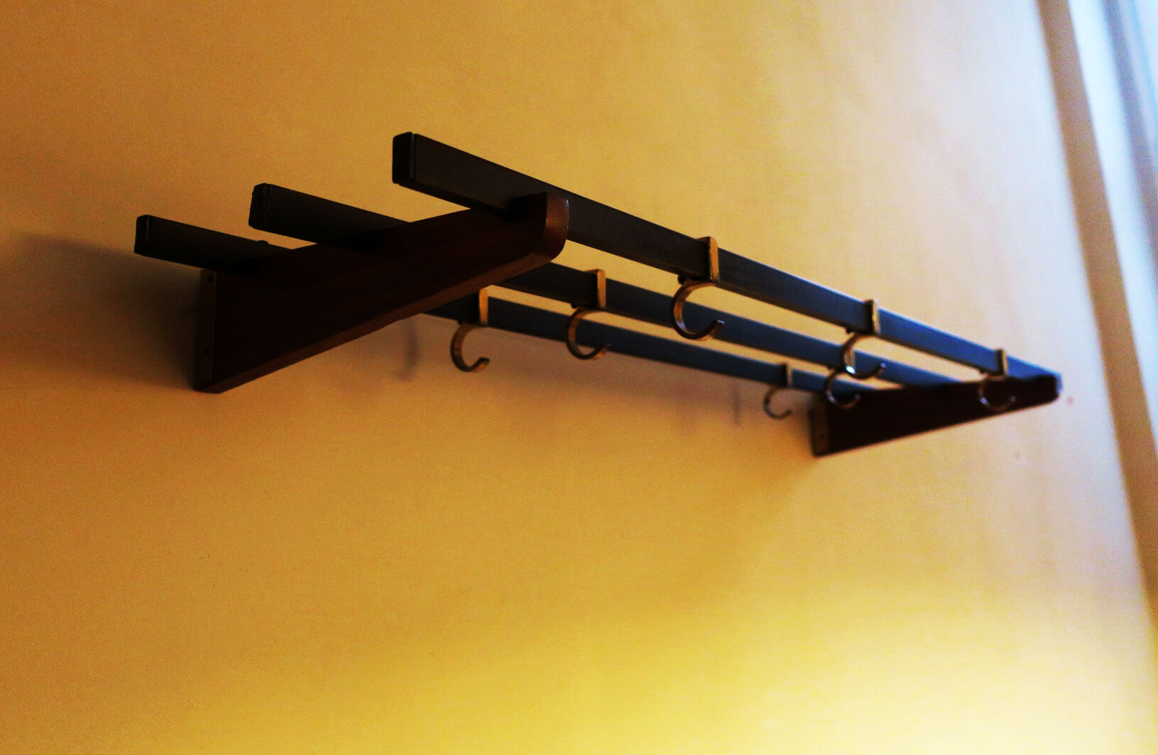 Teak, brass and black metal coat and hat rack, 1960