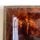 Plate of lucite scale and patinated brass