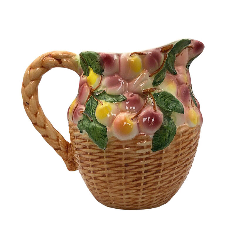 Vintage pitcher in cherry patterned dabbling