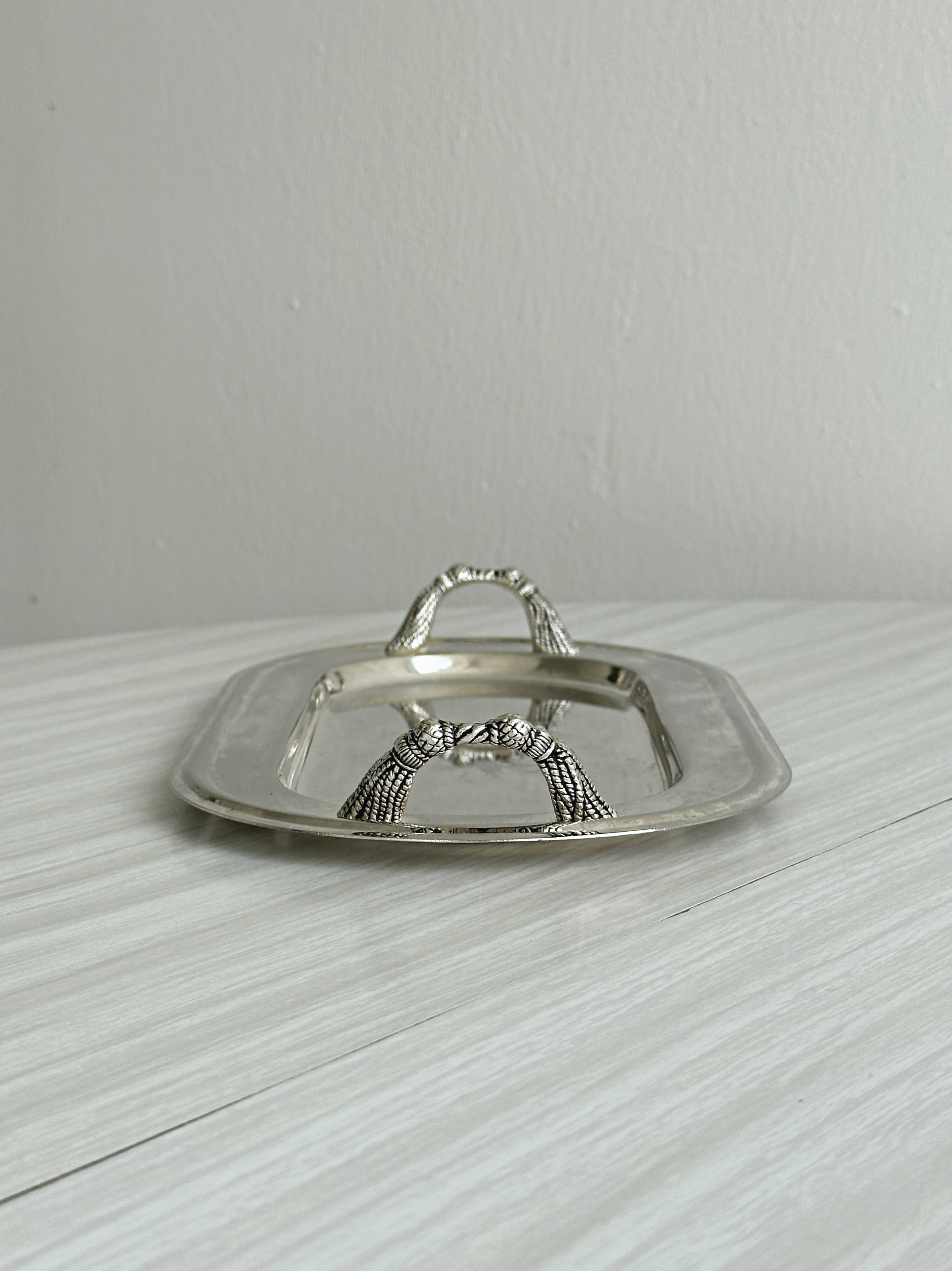Vintage silver plateau with knot handles.