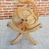 Vintage American swivel chair in wood and cane.