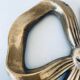 Dessous de plat en laiton forme noeud