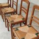 Set of 4 designer oak and straw chairs from the 1950s