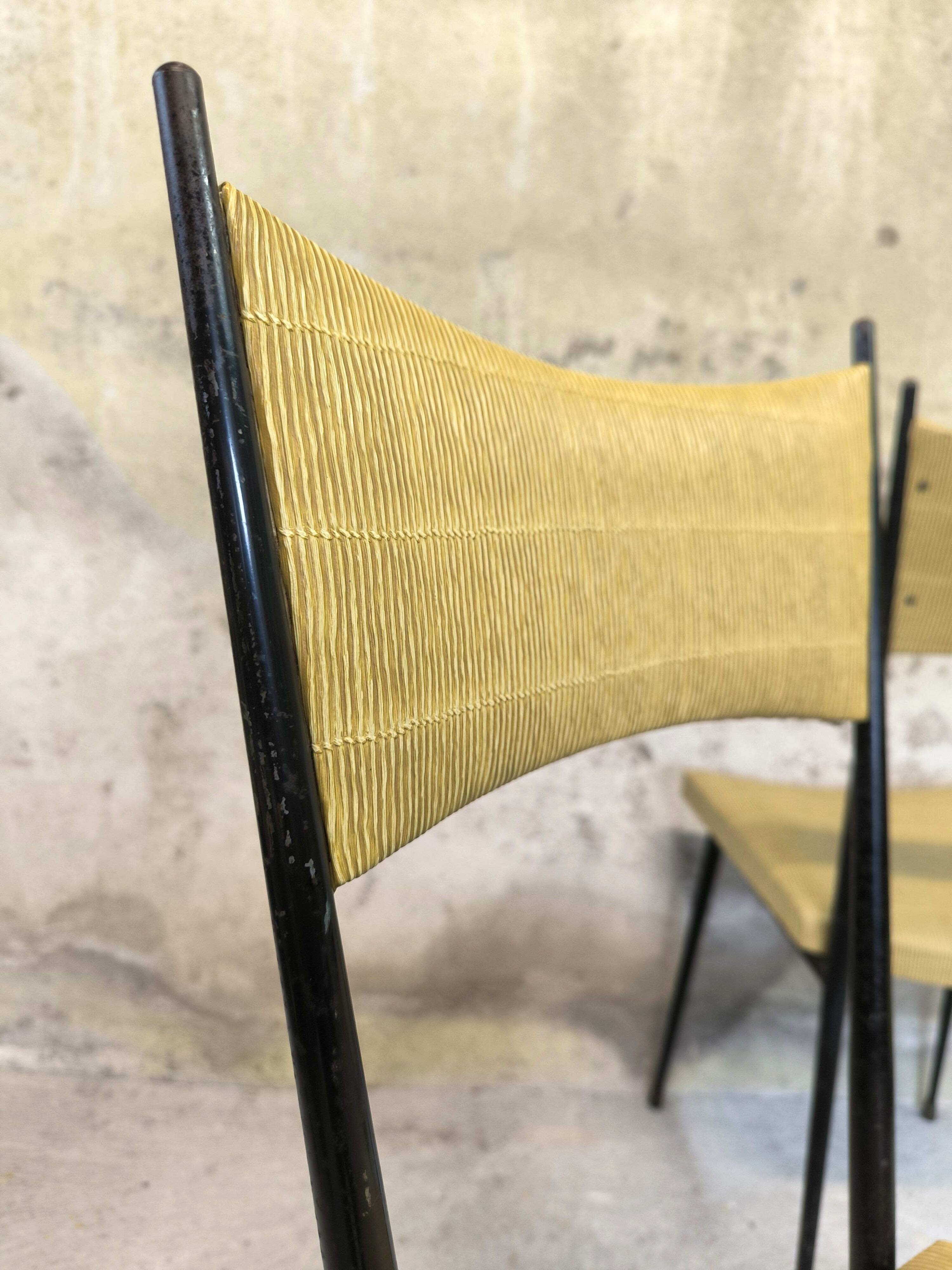 Three vintage chairs in the style of Colette Gueden.