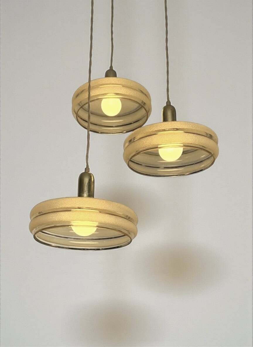 Triple cascade pendant light with vintage frosted glass globes and gold finish