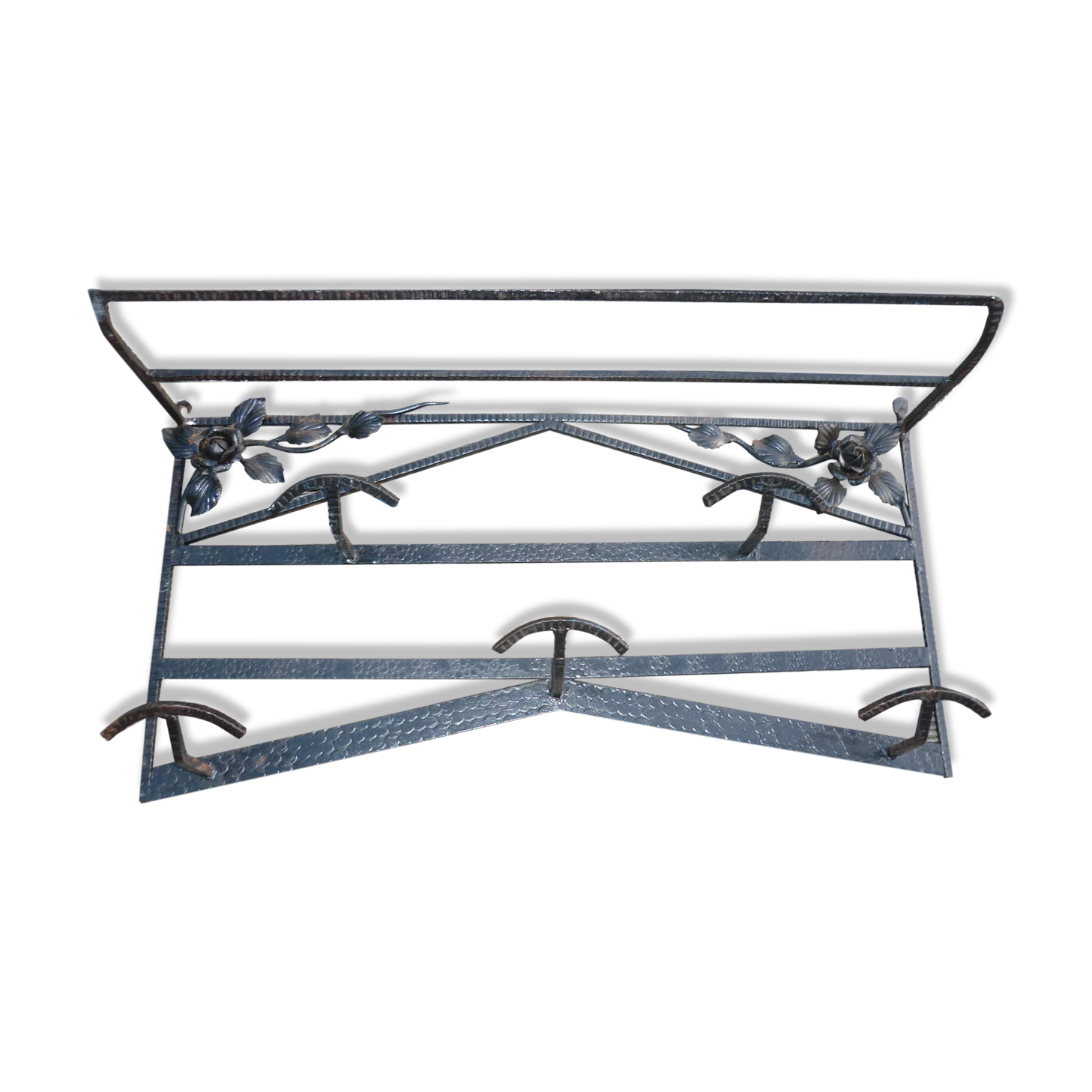 Wrought iron vest and a shelf with a hat