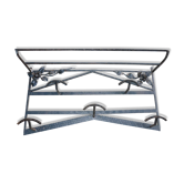 Wrought iron vest and a shelf with a hat