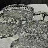 Circular glass ashtray with stylized petal patterns