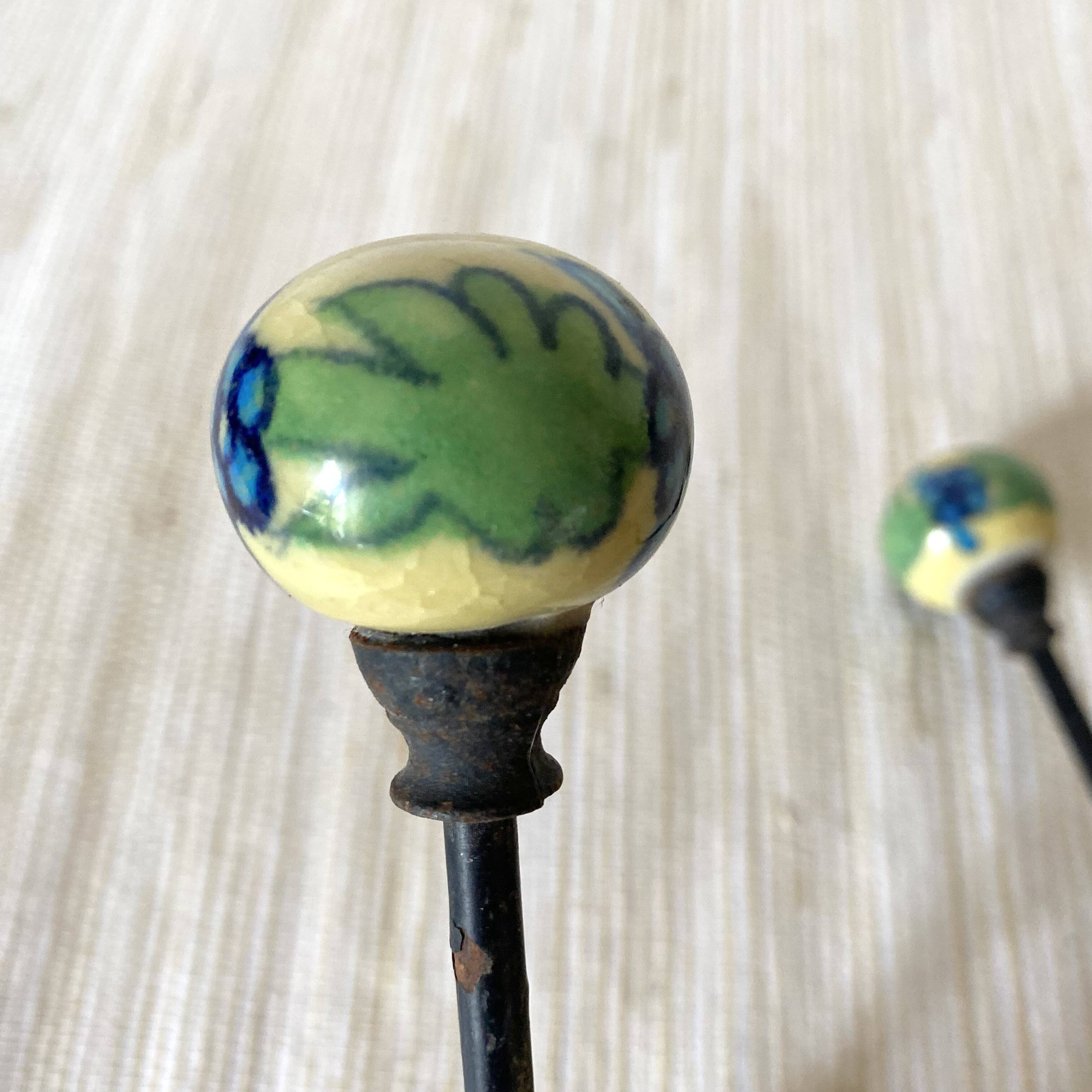 Metal and flowered ceramic coat hooks