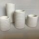 Four white earthenware candle holders