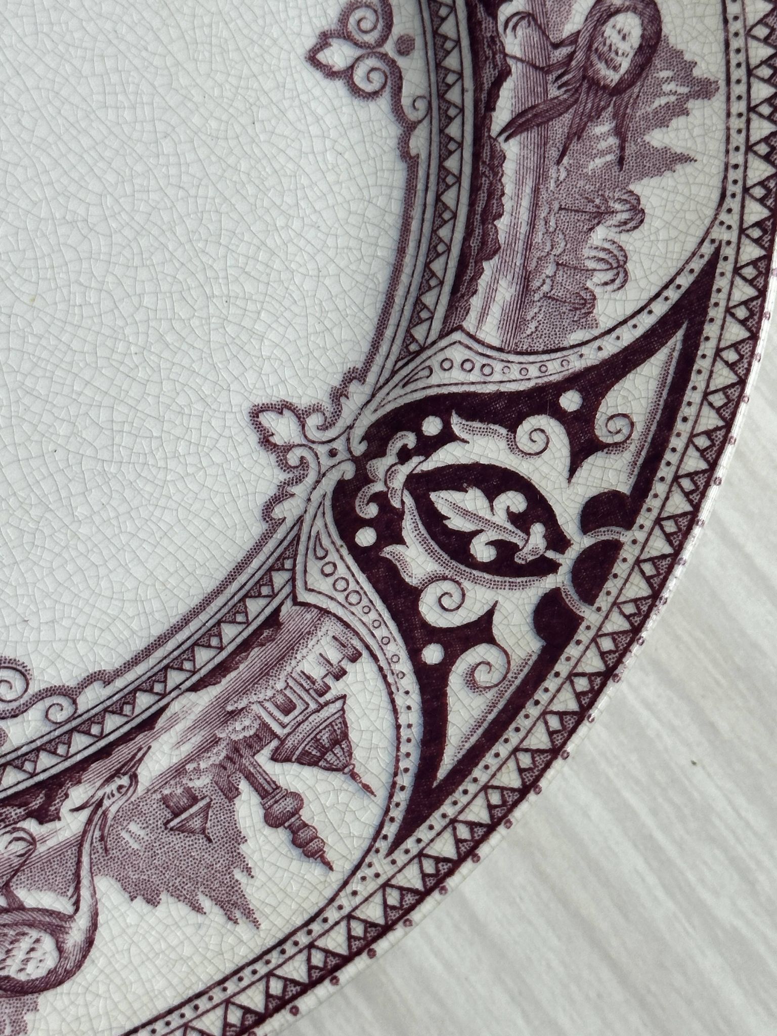 Antique plate with purple oriental decoration