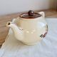 Vintage pouring teapot in Longchamp earthenware, Agen model.