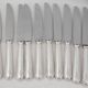 Ercuis Trianon, Rubans, 12 silver-plated table knives, excellent condition.