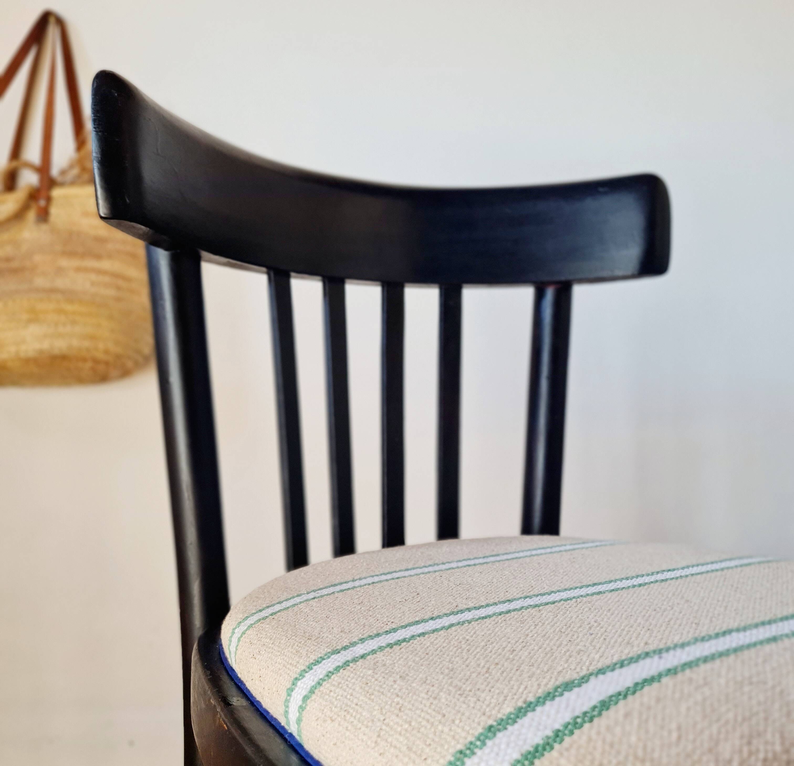 Curved black wooden bistro chair with striped seat