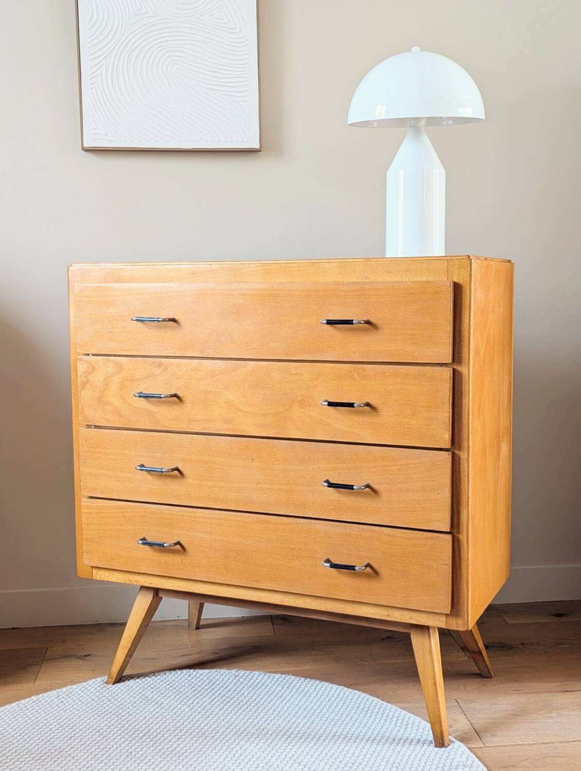 Vintage chest of drawers with tapered legs from the 1960s.