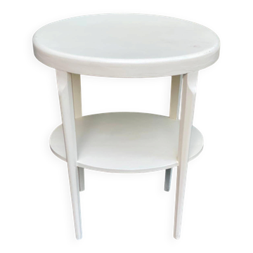 Vintage solid wood stool painted in beige.