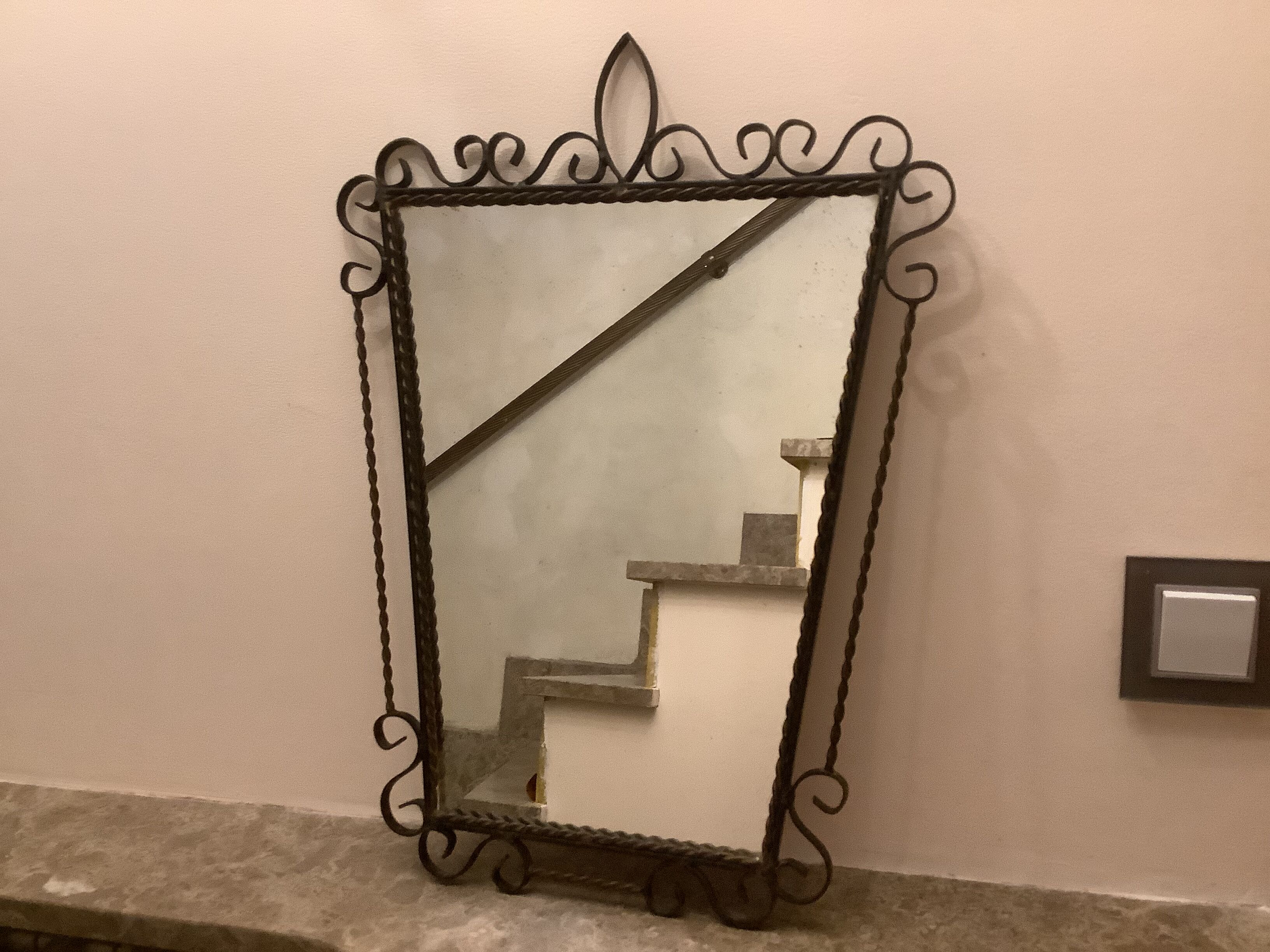 Ancient asymmetrical brutalist mirror wrought iron