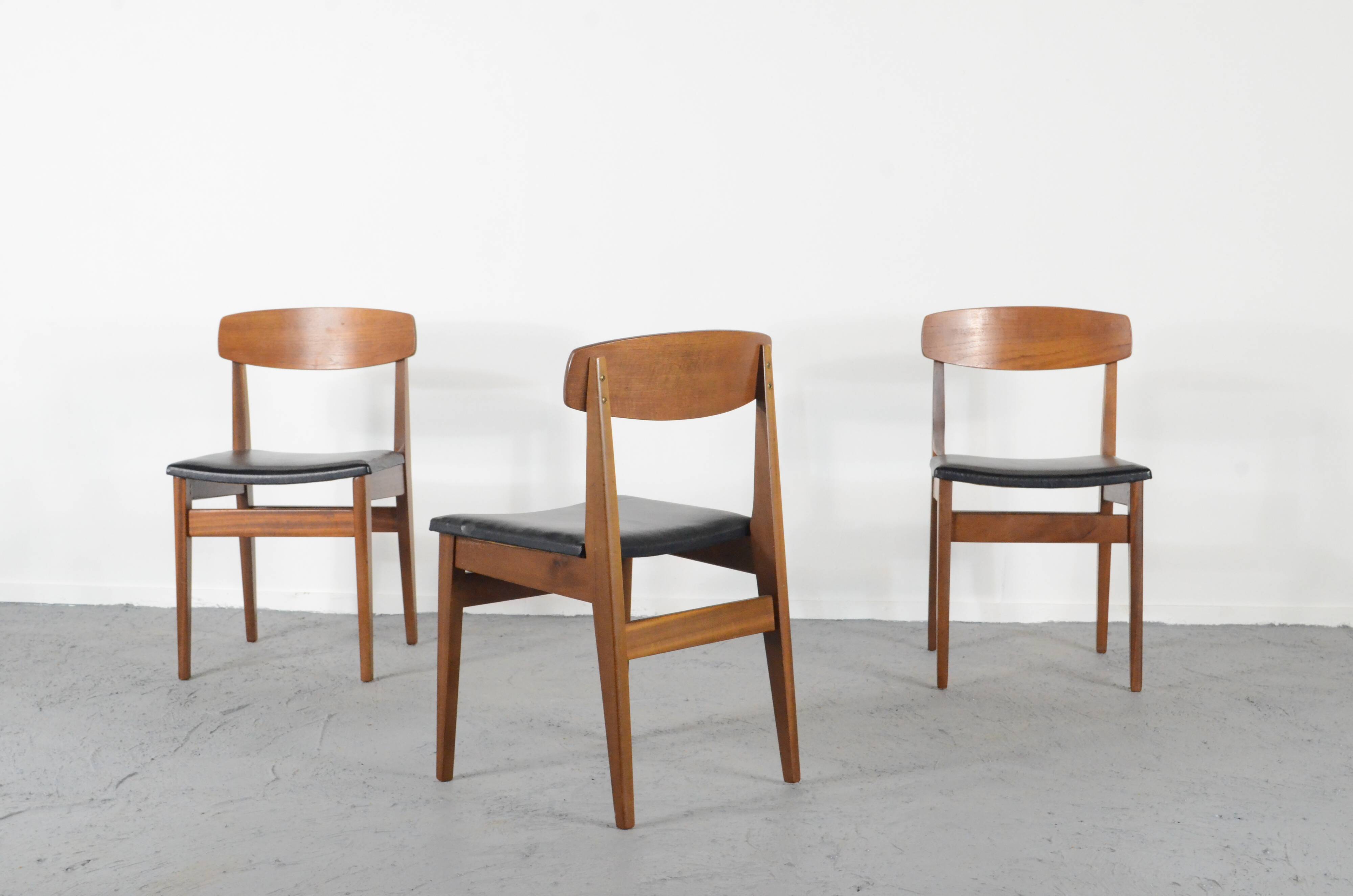 Set Of 4 Midcentury Teak And Leatherette Chairs.